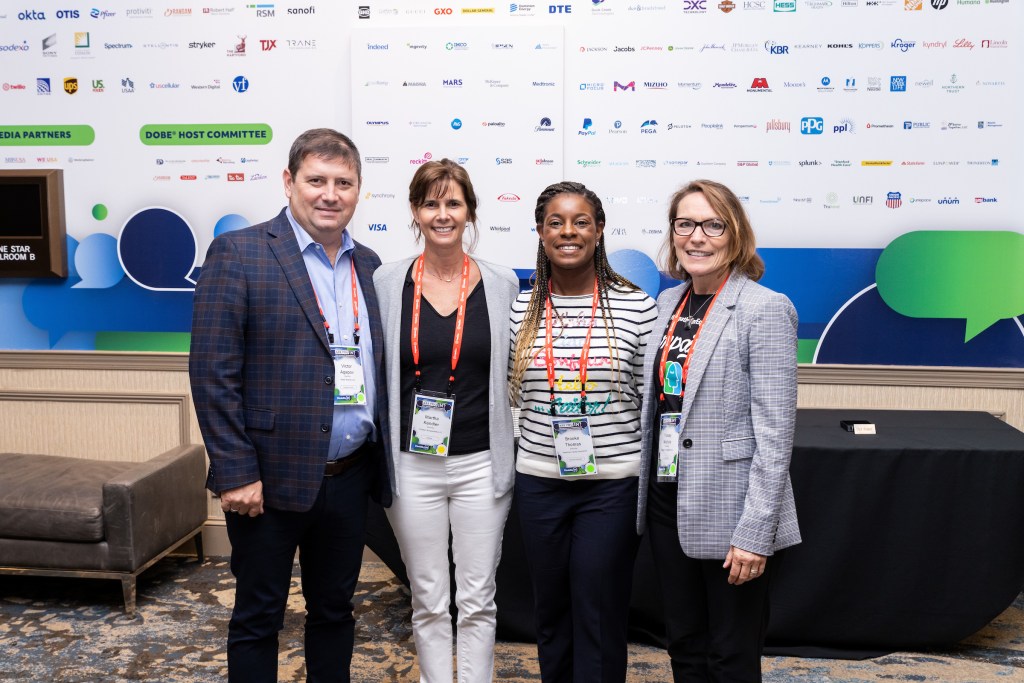 Four people standing as a group representing Disability:IN Wisconsin Affiliate.
